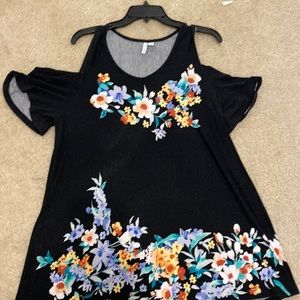 Elle shirt. On the longer side. Hangs off both shoulders